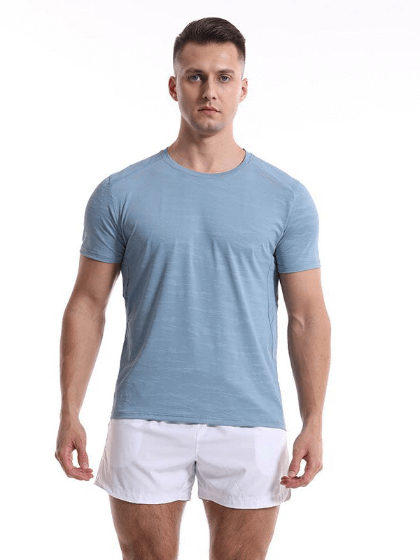 Man wearing a blue Casual Short Sleeves Basketball Elastic T-shirt and white shorts, ideal for sports and exercise.